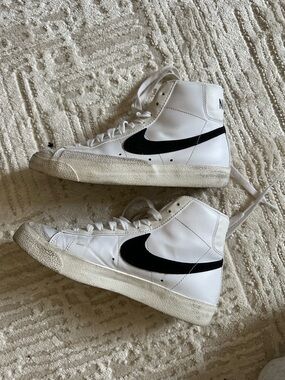Nike White High-Top Sneakers with Black Swoosh